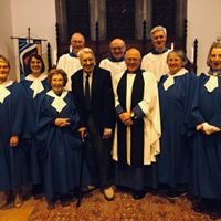 Rob and Margaret North with choir members in blue robes
