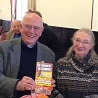 Rob and Margaret North with a "Retirement Warning" book.