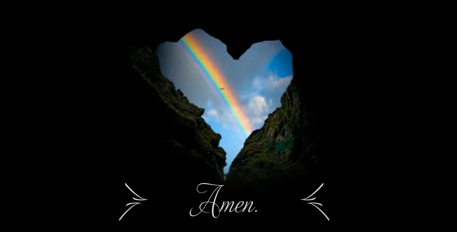 A heart-shaped gap in dark rock reveals a rainbow and blue sky, with the word 'Amen' below.