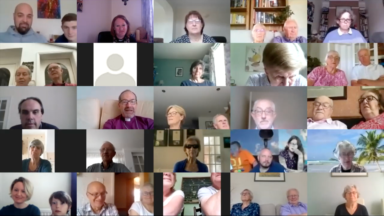 Screenshot of a Zoom video call grid with around 25 participants, several waving to the camera.