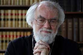 Archbishop Rowan Williams, former Archbishop of Canterbury, with hands clasped