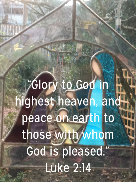 Nativity silhouette scene with Bible quote: 'Glory to God in highest heaven, and peace on earth to those with whom God is pleased.' Luke 2:14