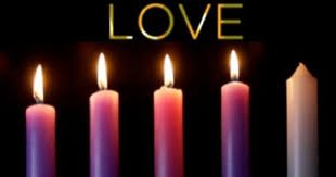 Four Advent candles lit, three purple and one pink, beside a fifth unlit candle, under the word 'LOVE'.