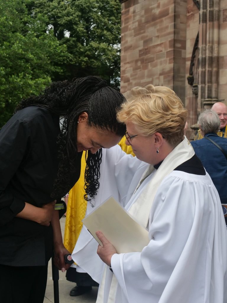 Christine Ordained Priest at Hereford Cathedral: Reverend blesses parishioner.