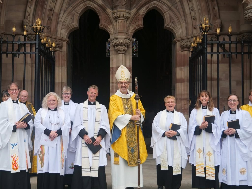 Christine ordained priest at Hereford Cathedral: Bishop and clergy outside.
