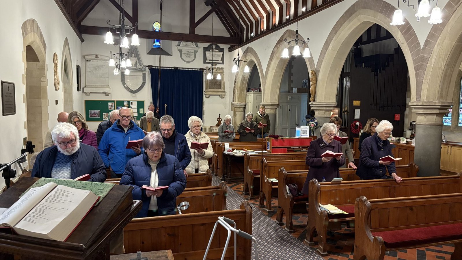 Congregation at St. Michael's, Breinton, singing hymns during a church service.